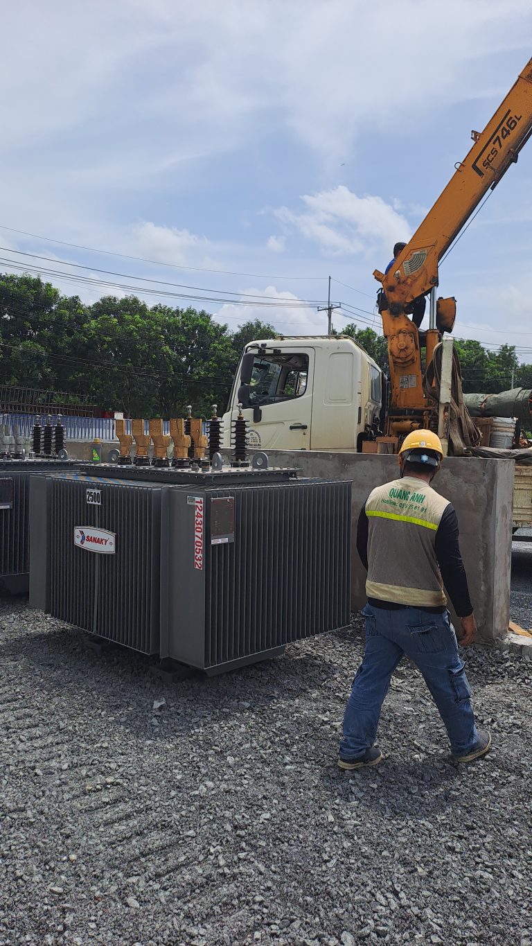 Engineers checking transformers at a substation.