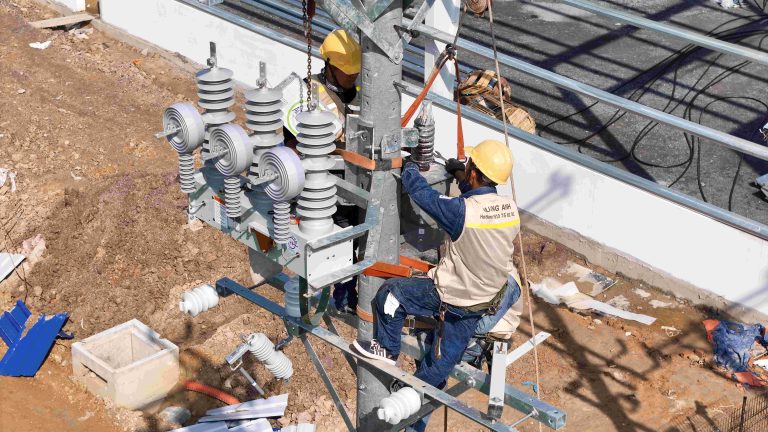 Engineer monitoring control panel at a substation.