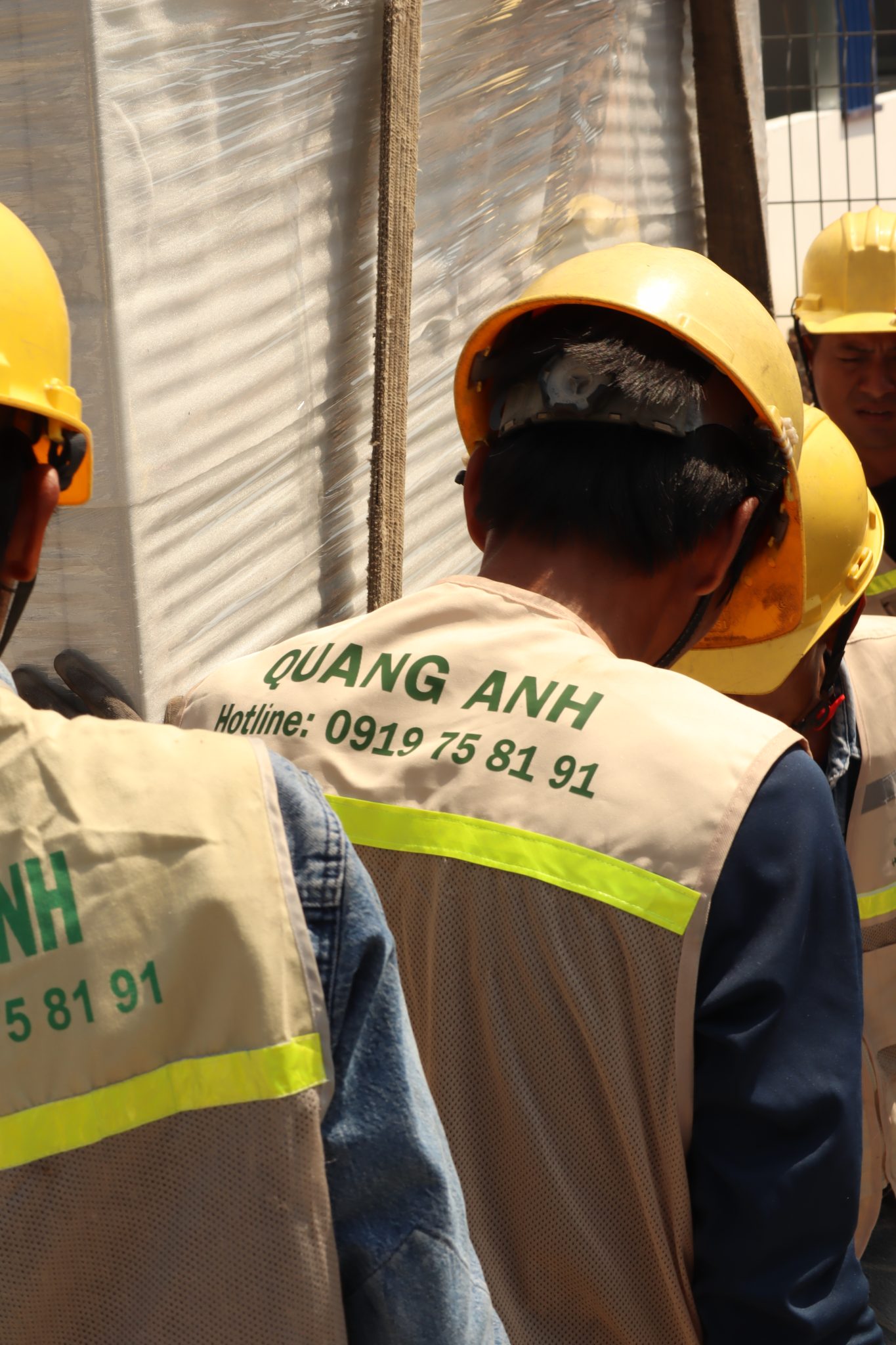 QuangAnhcons engineers at a construction site.